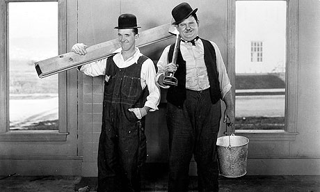 STAN LAUREL and OLIVER HARDY posing as builders STAN LAUREL, OLIVER HARDY STAN LAUREL, OLIVER HARDY 