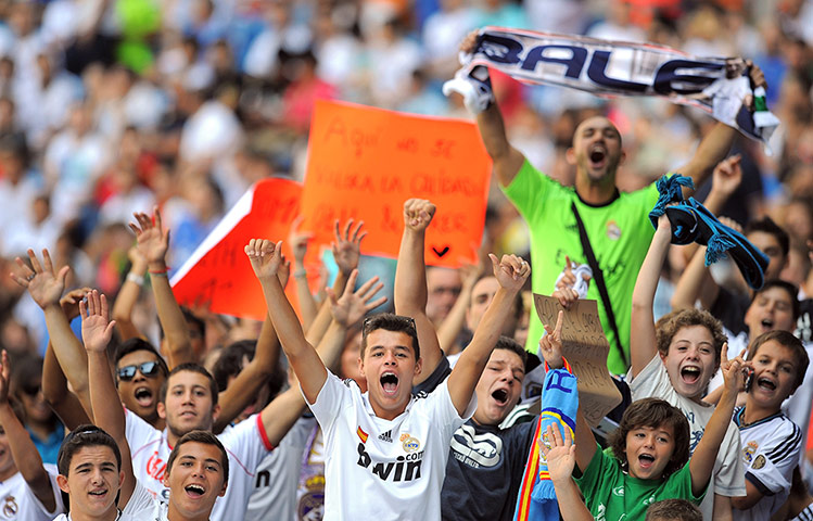Bale arrives in Madrid: Real Madrid fans cheer as they wait for the arrival of Gareth Bale