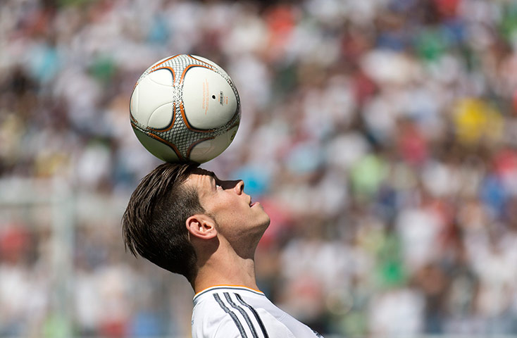 Bale arrives in Madrid: Welsh international soccer player Gareth Bale balances the ball on his head