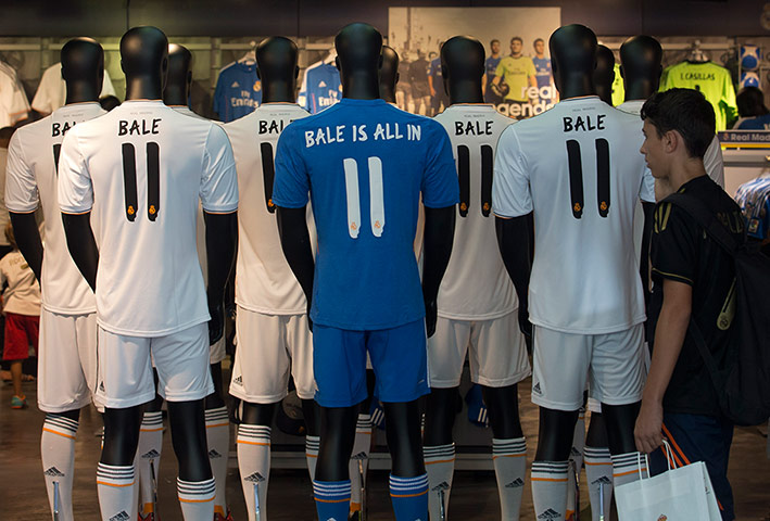 Bale arrives in Madrid: The official Real Madrid shop where Gareth Bale soccer shirts are already d