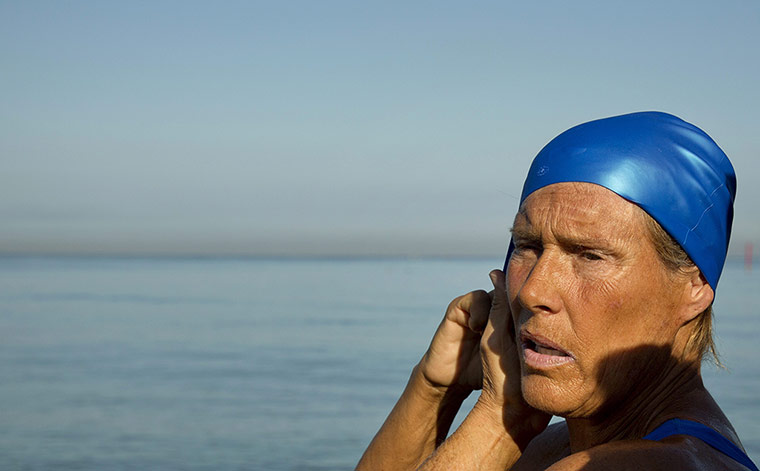 Swimmer Diane Nyad: Swimmer Diana Nyad fixes her hat