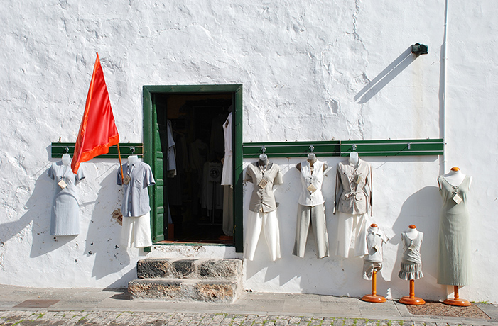 Your Pics - Mysterious: white exterior of building with mannequins hanging outside