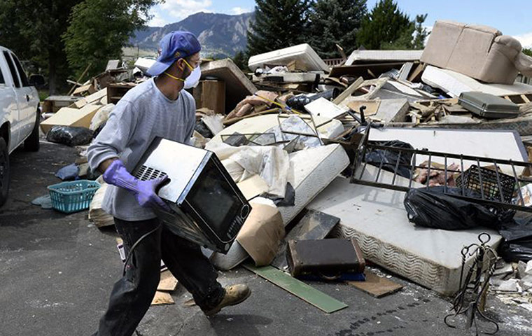 colorado after flood: Adan Zepeda, of Overtime Landscaping