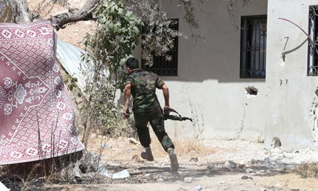 A Syrian government soldier in combat in Damascus