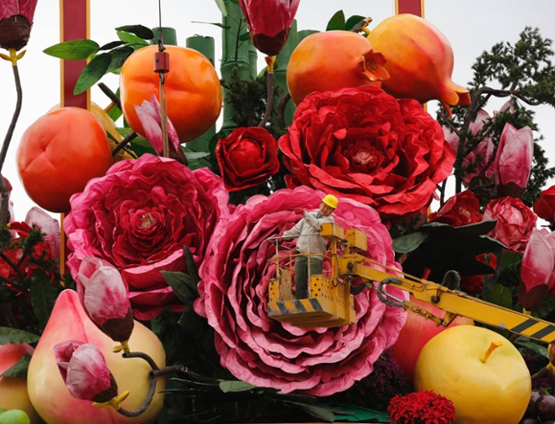 As a play on perspective this picture is worth a second look. The worker on the crane is dwarfed by the gigantic fruit and flower display he's installing as part of the celebrations for China's forthcoming National Day at Tiananmen Square in Beijing.