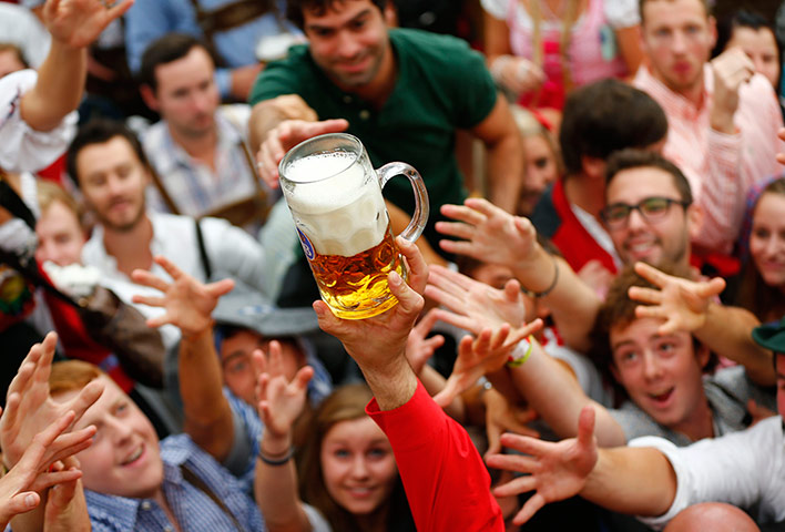 oktoberfest: Visitors reach for the first mug of beer 