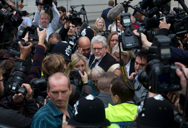 Photographer Matt Dunham had to be a clear head and shoulders above his colleagues to take this picture of Rolf Harris leaving Westminster Magistrate's Court in London today. It was the entertainer's first court appearance over child sex offences.