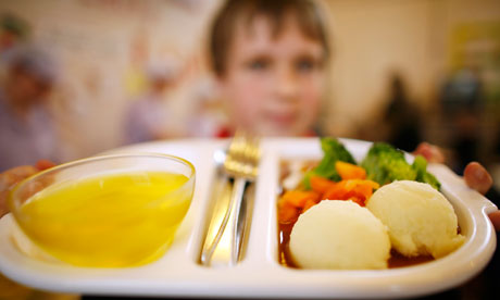 Child shows tray full of healthy food