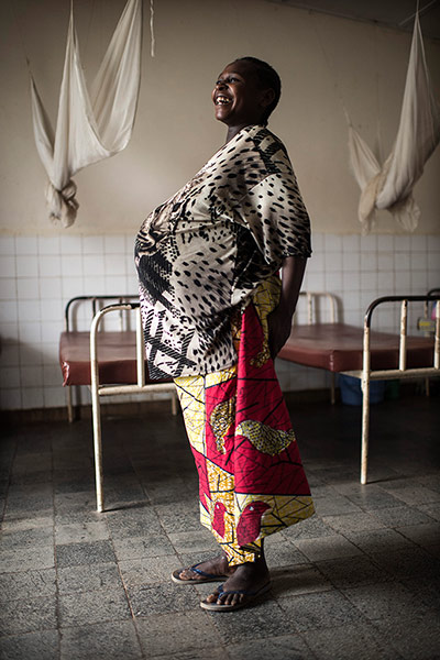 Making babies: A woman pregnant with twins stands in a maternity ward