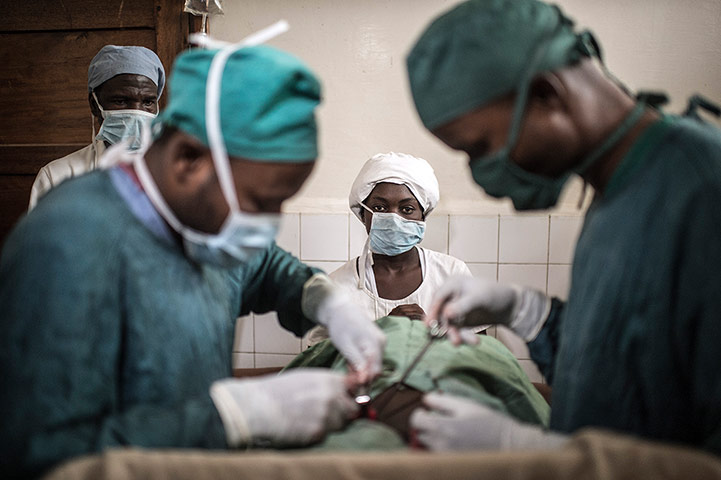 Making babies: Dr Fabien Kibayila Dizo during an operation at a health centre 