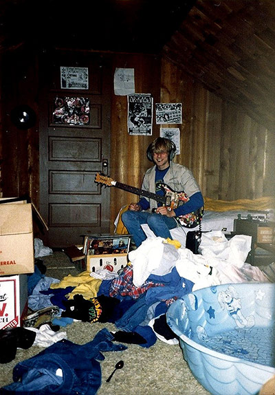 Cobain home: Kurt Cobain plays guitar in his childhood bedroom