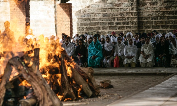 Members of the Kenyan Sikh community come together in Nairobi to cremate a grandmother and son who were killed when terrorists took over the Nairobi Westgate shopping Mall. The country is marking the first of three days of mourning, with flags being flown at half mast. Somber, religious and nationalist music was being played on television stations to a backdrop of scenes of rescue from the attack.