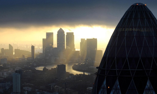 The 'Gherkin' and Canary Wharf at sunrise in the City of London.