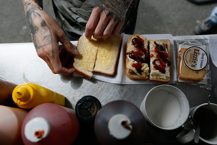 Roadside snacks: A man prepares a sandwich outside a snack van along the A22 near Caterham