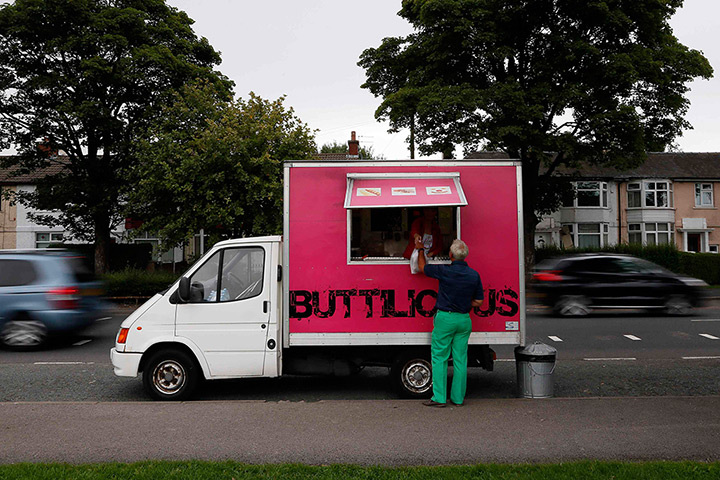 Roadside snacks: Amy Stanhall serves a worker at her Buttilicious snack van along the A5085 