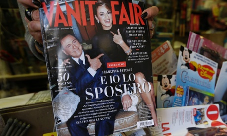 A copy of the Italian edition of Vanity Fair magazine, carrying a photo of Silvio Berlusconi, left, and his girlfriend Francesca Pascale, as it is displayed at a newsstand in Rome, Wednesday, Sept. 25, 2013.