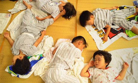 Japanese children take a nap at preschool