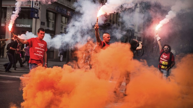 Employees of the French chemical firm Kem One light flares in the streets of Lyon, giving their demonstration a visual drama. The 1,300 employees of Kem One, which was placed into receivership in March, were due to be informed about potential buyers and their restructuring projects but the court has delayed its final decision until December.