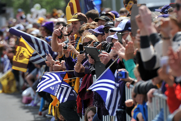 AFL Parade: Fans take photos of the parade