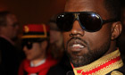 Rapper Kanye West poses at the Devi Kroell fashion show