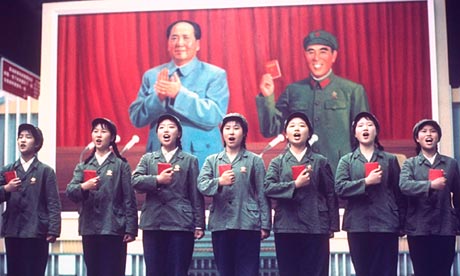Chinese singers perform with their copies of the Little Red Book in hand 