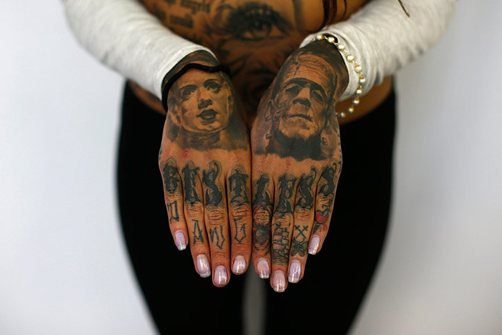 head tatoo: Cleo displays tattoos on her hands 