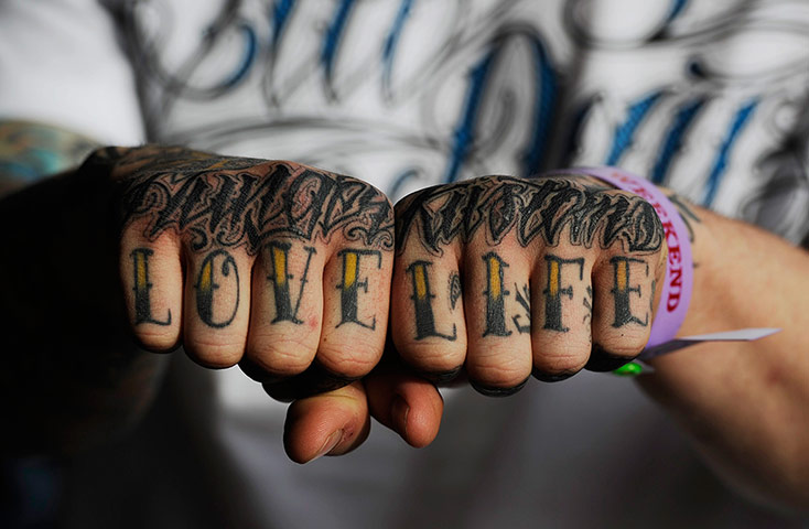 head tatoo: A man shows his tattoo at the London Tattoo Convention