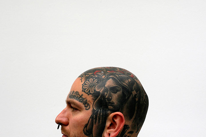 head tatoo: Jakub displays a tattoo on his head