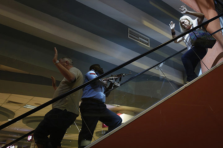 20 Photos: A police officer secures an area inside Westgate Shopping Mall in Nairobi