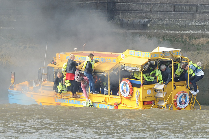 Duck boat fire: Passengers cling to the outside of the amphibious vehicle