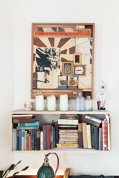 Homes - Oliver Jeffers: Bookshelf with picture above hung on wall