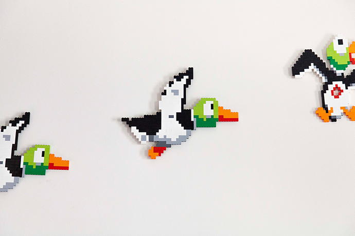 Homes - Oliver Jeffers: Three bird ornaments hung on cream coloured wall