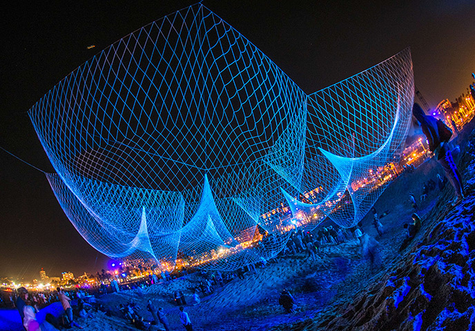 Glow Santa Monica: Visitors explore the creation of artist Janet Echelman The Space Between Us
