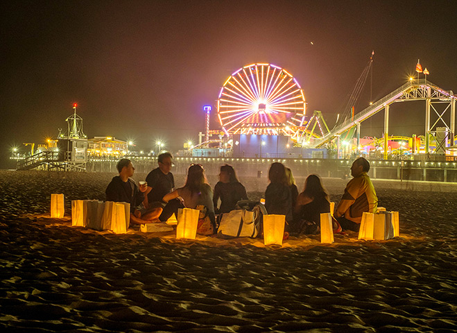 Glow Santa Monica: Visitors have a picnic on the beach