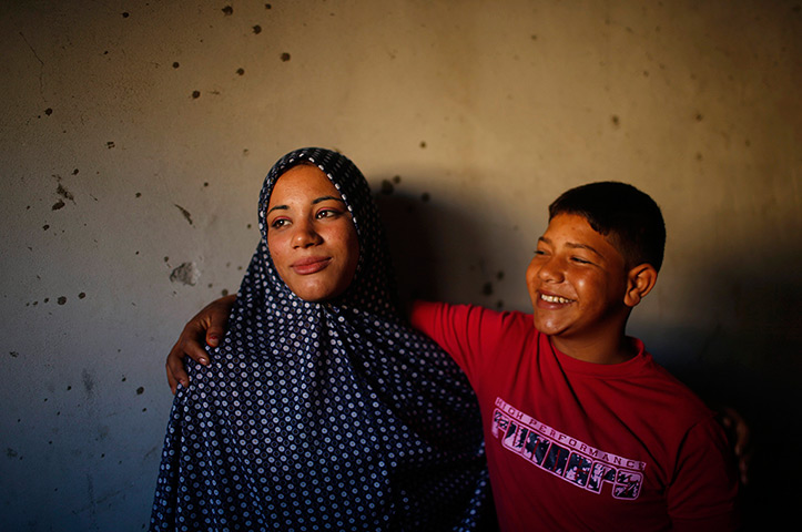 Young newlyweds: The newlywed couple pose 