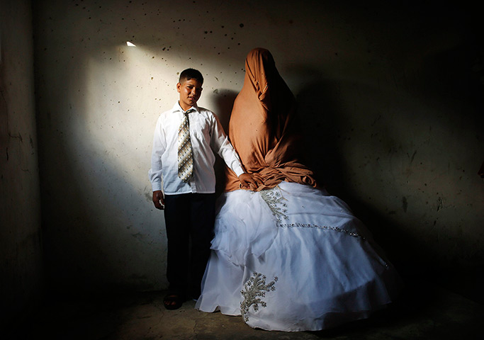 Young newlyweds: Palestinian groom Ahmed Soboh, 15, and his bride Tala, 14, stand inside Tal