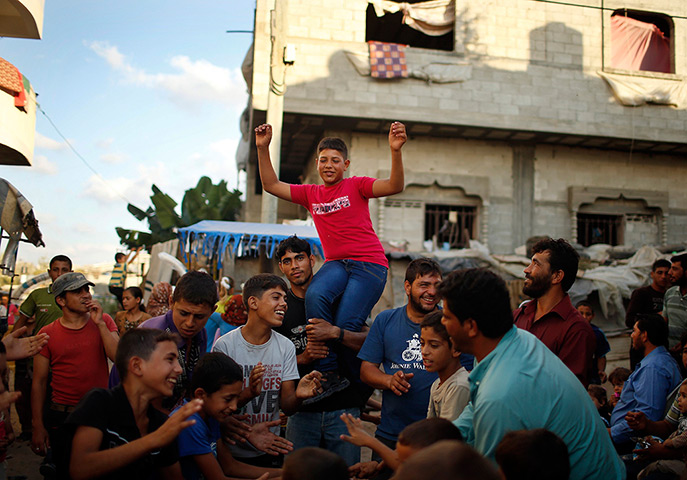 Young newlyweds: Groom Ahmed Soboh is welcomed by his relatives a day before his wedding par