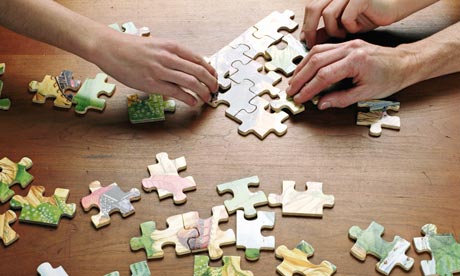 People doing a puzzle