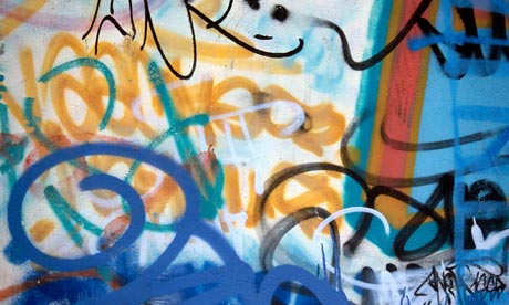 Colourful mixed up graffiti on a wall