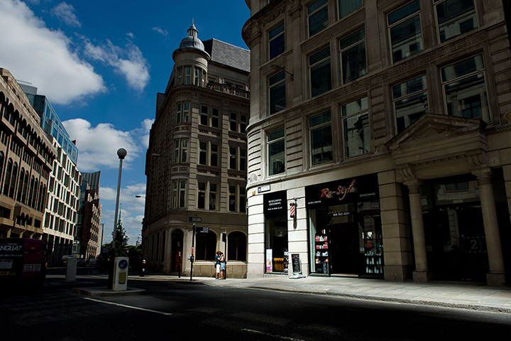 Walkie scorchie: A young couple kiss as they stand in a shaft of intense sunlight 