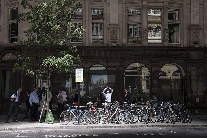 Walkie scorchie: City workers walk past bicycles in Eastcheap