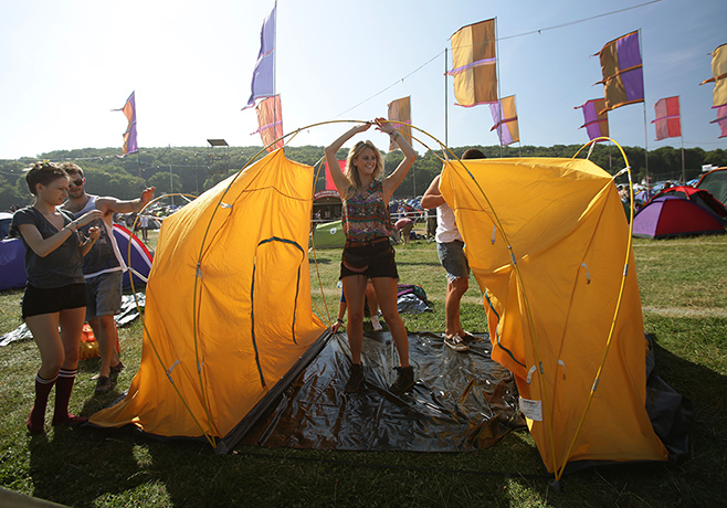 Bestival day one: Festival goers erect their tents