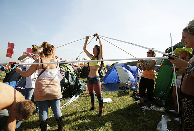 Bestival day one: Festivalgoers erect their tents