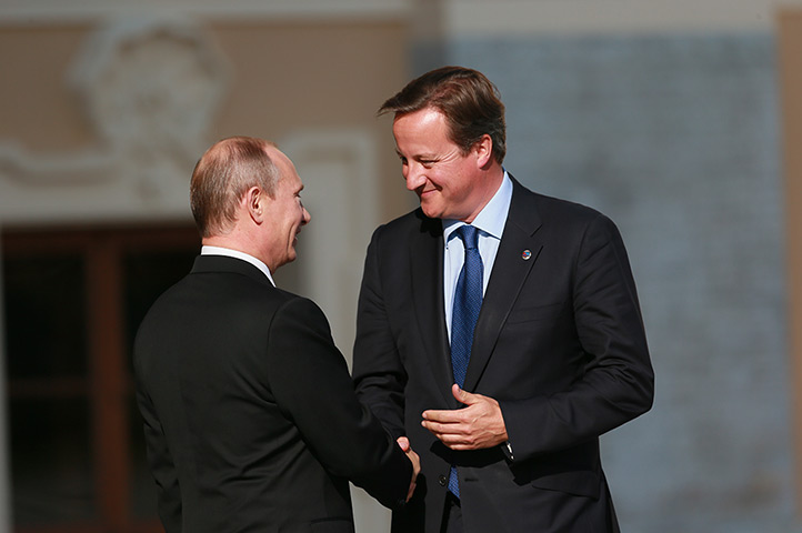 G20 official welcome: Russian President Vladimir Putin greets British Prime Minister David Camero