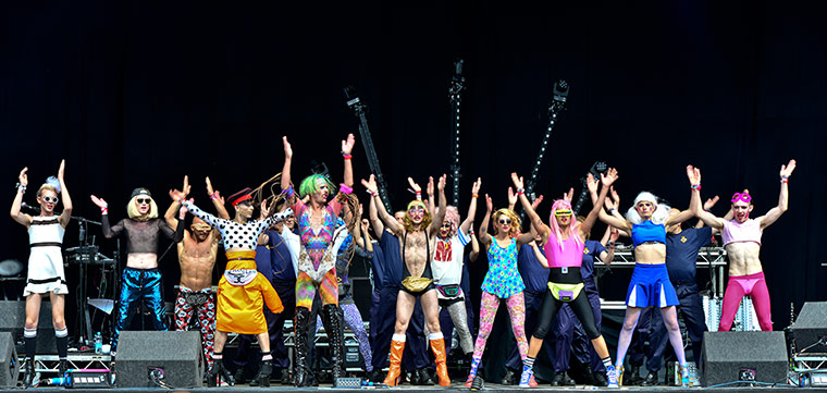 Bestival 2013: Sink the Pink members lead the crowd through a keep-fit programme on the main stage