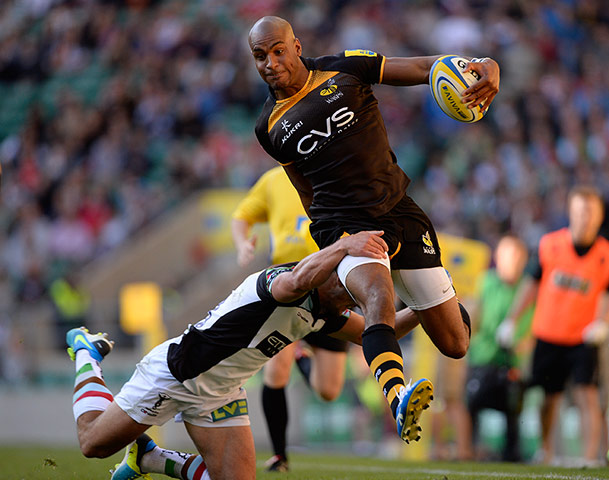 Rugby at Twickenham: Tom Varndell skips over the challenge of George Lowe