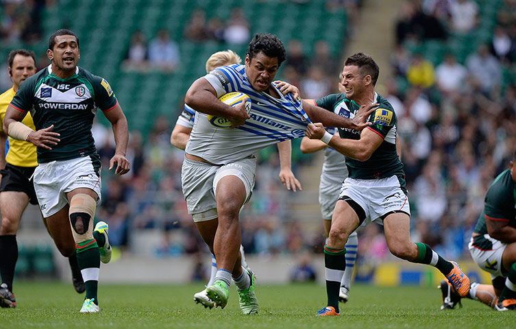 Rugby at Twickenham: Billy Vunipola of Saracens is dragged back by Ian Humphreys 
