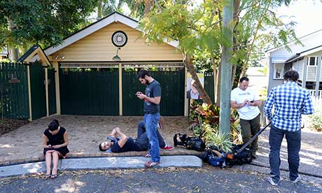 Members of the media wait outside Kevin Rudd's home in Brisbane.