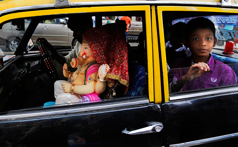Hindu God Ganesha : An idol of Hindu god Ganesha in a taxi