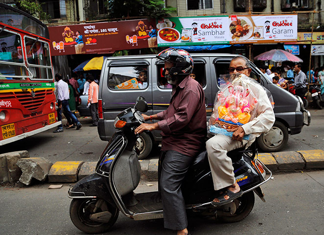 Hindu God Ganesha : An idol of the Hindu God Ganesha on a scooter